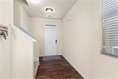 Transom window above front door and casement windo