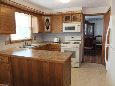 Kitchen with tile backsplash.