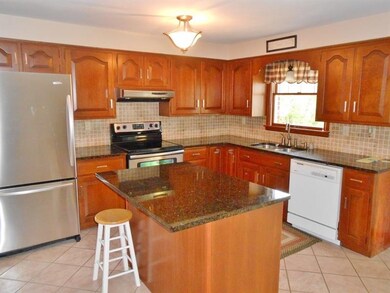 Equipped Amish built cherry kitchen with granite c