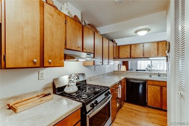 Galley Kitchen with new stainless gas stove. Pantr