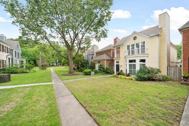View of front of house featuring a front yard and a chimney