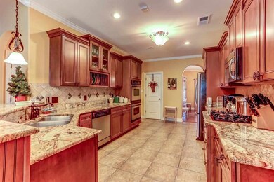Kitchen has double oven, gas cooking, tumbled marb