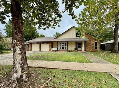 View of front of home with driveway, a porch, brick siding, an attached garage, and a shingled roof