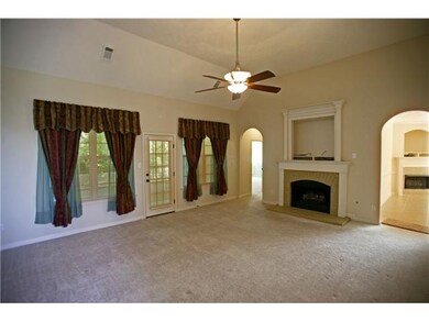 Huge living room with 12 foot ceilings and gas fir