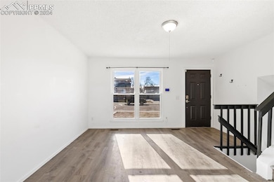 Foyer featuring hardwood / wood-style flooring and