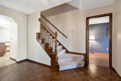 Entry staircase and den