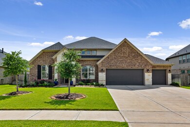 Gorgeous stone, brick & gutters on all 4 sides of the homes exterior.