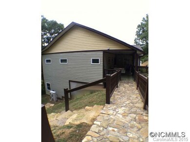Stone walkway leads to carport