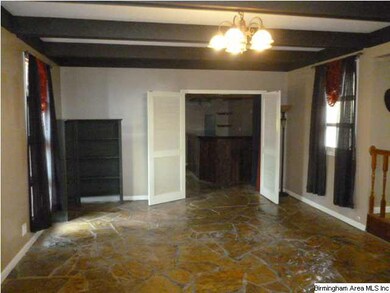 view of den with stone flooring