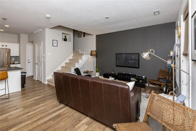 Living area with custom flooring and blinds
