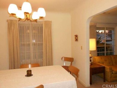 formal dining room with large picture window also.