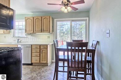 Dining area overlooks spacious backyard