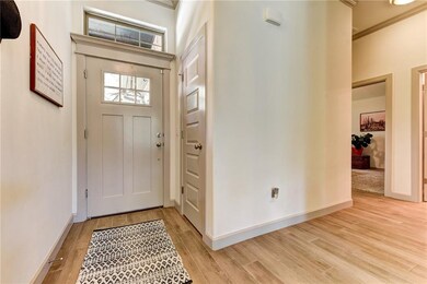 Entry with Wood-look tile that runs thoughout the 