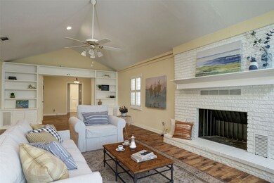 Beautiful virtually staged family room with firepl