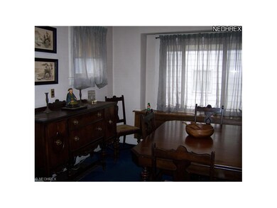 The formal dining room has a window seat.
