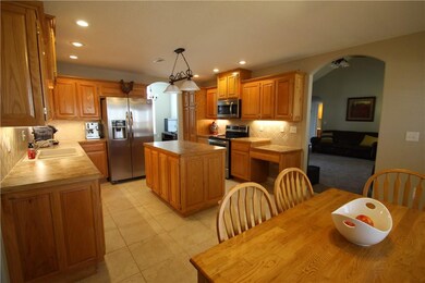Large island has  drawers and cabinets  Built in desk, cabinet pantry is in addition to the full size pantry.