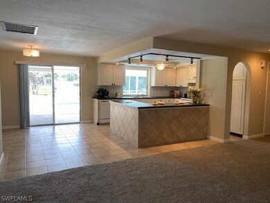 View of kitchen and partial dining area from newly