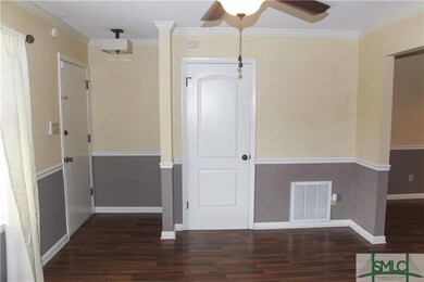 Living room with spacious coat closet.