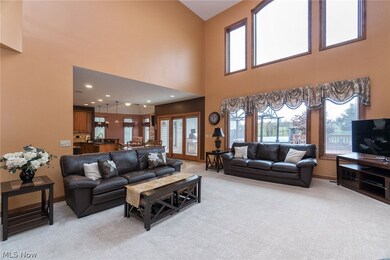 2 story Great Room.  Lots of light and windows to enjoy the wooded views to the backyard. Next to deck walk out and kitchen area.