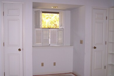 Cozy den with pocket doors, book cases and 2 close