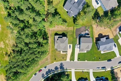 Backs to woods and wooded area in front