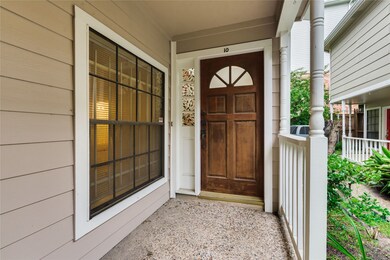 Covered patio with enough space to put a bistro table or rocking chair.