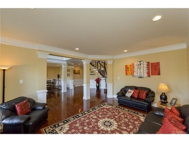 Formal Living Room with hardwood floors, columns, 