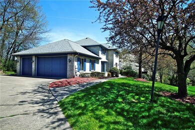 Grand level entrance and three car attached garage