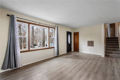 Unfurnished living room with light hardwood / wood