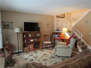 The Living Room boasts new bamboo floors and plant