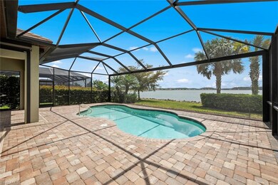 Pool featuring a patio, a water view, and a lanai