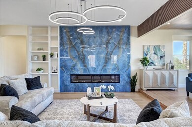Living area featuring wood finished floors and a f