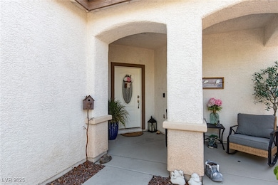 Doorway to property with stucco siding