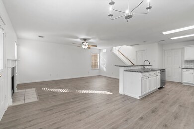 This spacious open-concept living area features a