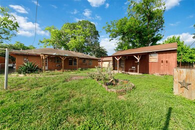 This photo showcases a spacious backyard with a la