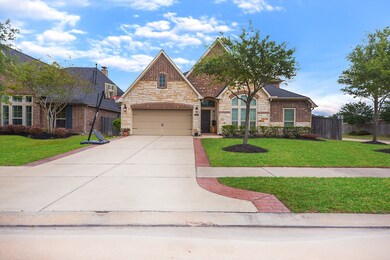 Home has 2 car garage and extended sides on the driveway.