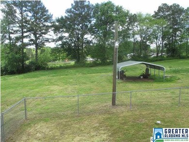 Back yard has a freestanding 2 car carport.