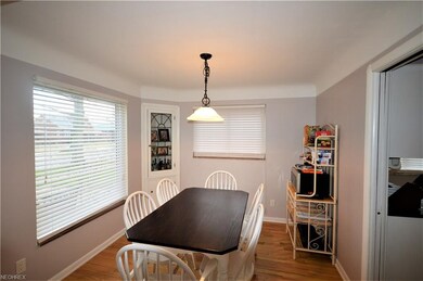 Updated family room with wood floors, white trim and plenty of natural ight!