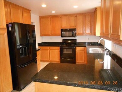 Kitchen with Oak cabinets and Granite counter tops