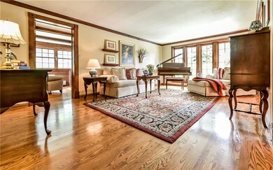 Living Room with Oak hardwood floors, crown moldin