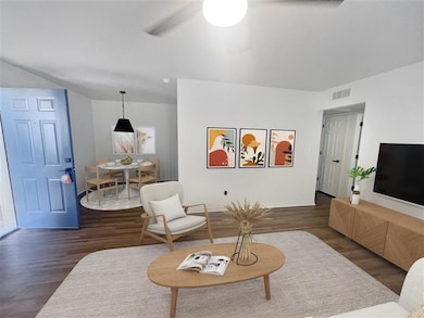 Living room featuring wood finished floors and baseboards