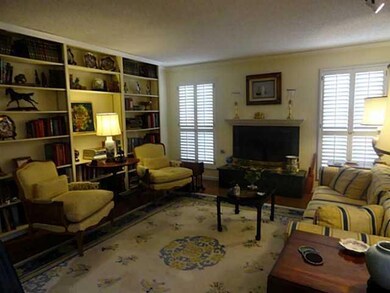 Living Room. A wall of bookcases & gas l