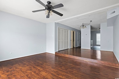 Spare room featuring visible vents, baseboards, a 