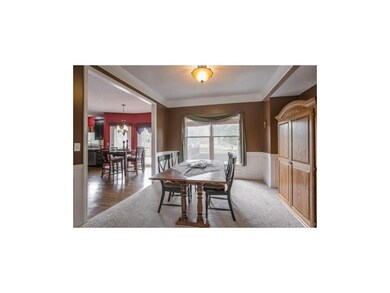 Dining Room with carpet flooring.