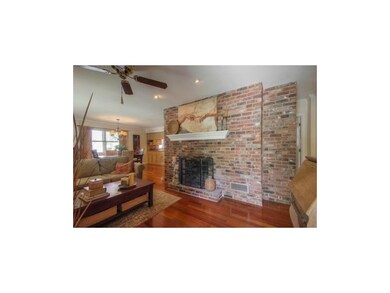 View from entryway of gas fireplace and open conce