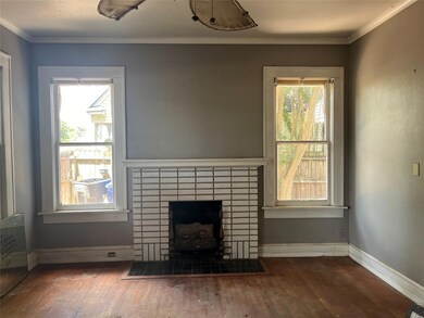 Unfurnished living room featuring hardwood / wood-