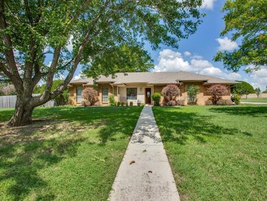 Isn't this a pretty walk up?  Beautiful sidewalk layout that draws you into the home.