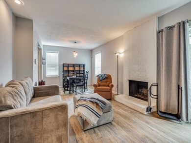 Open living and dining area with a lot of natural 