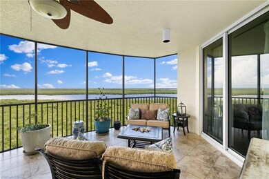 Sunroom / solarium with a water view, ceiling fan,
