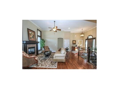 GREAT ROOM WITH SEE THROUGH FIREPLACE AND WOOD FLO